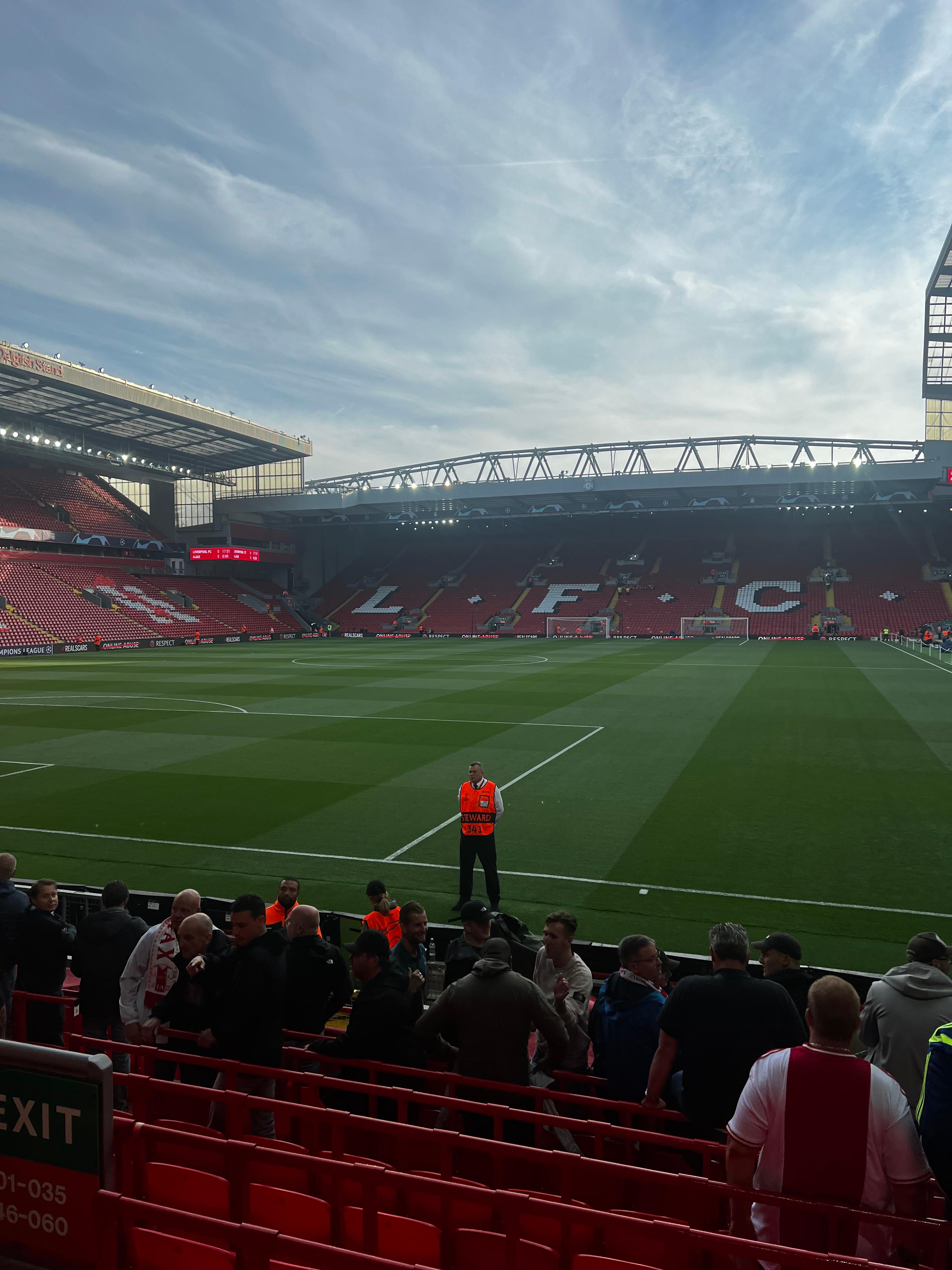 Inside Anfield Stadium pitch view with the Kop stand