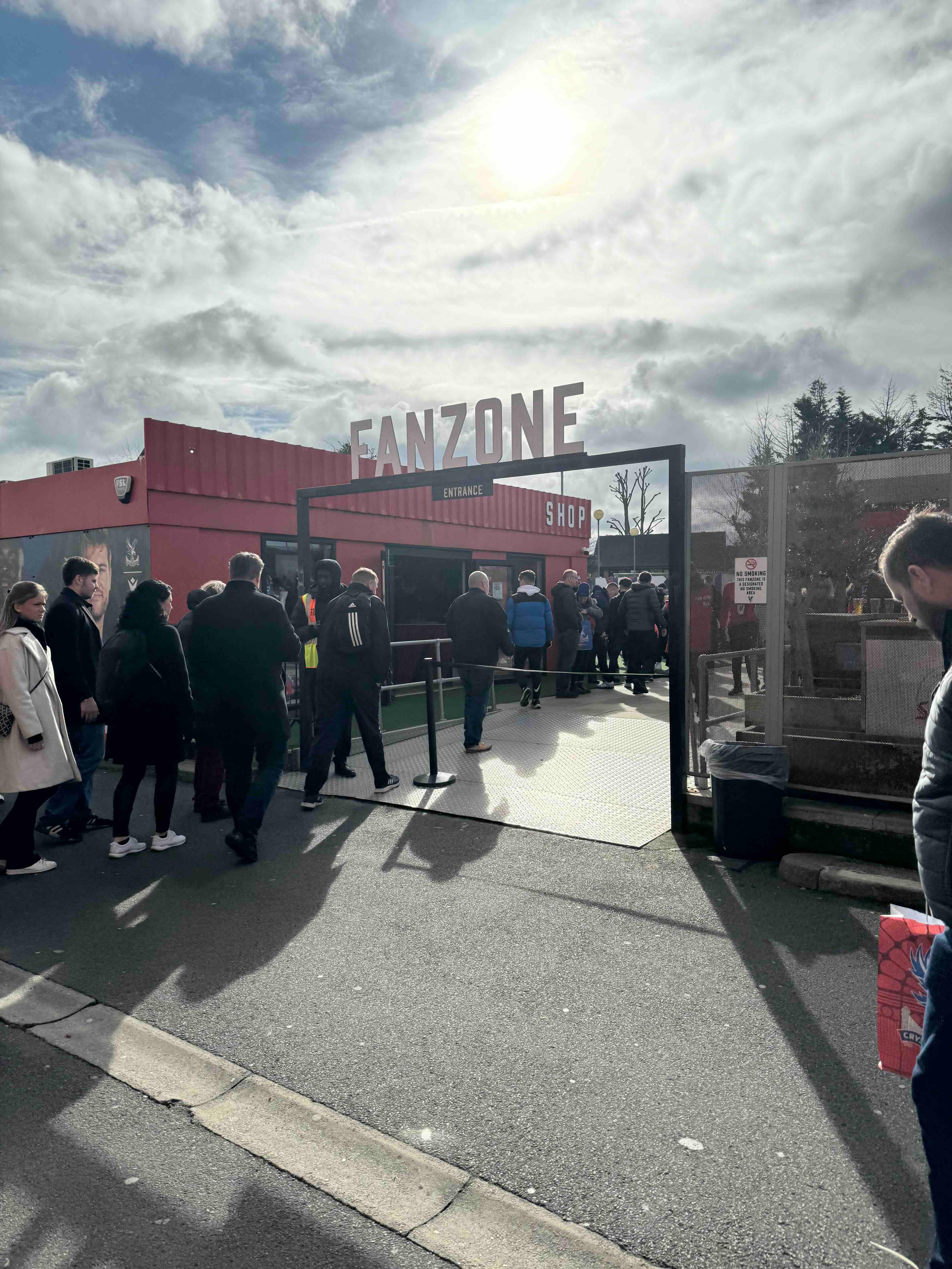 Fans entering the Crystal Palace fanzone outside Selhurst Park before kick off.
