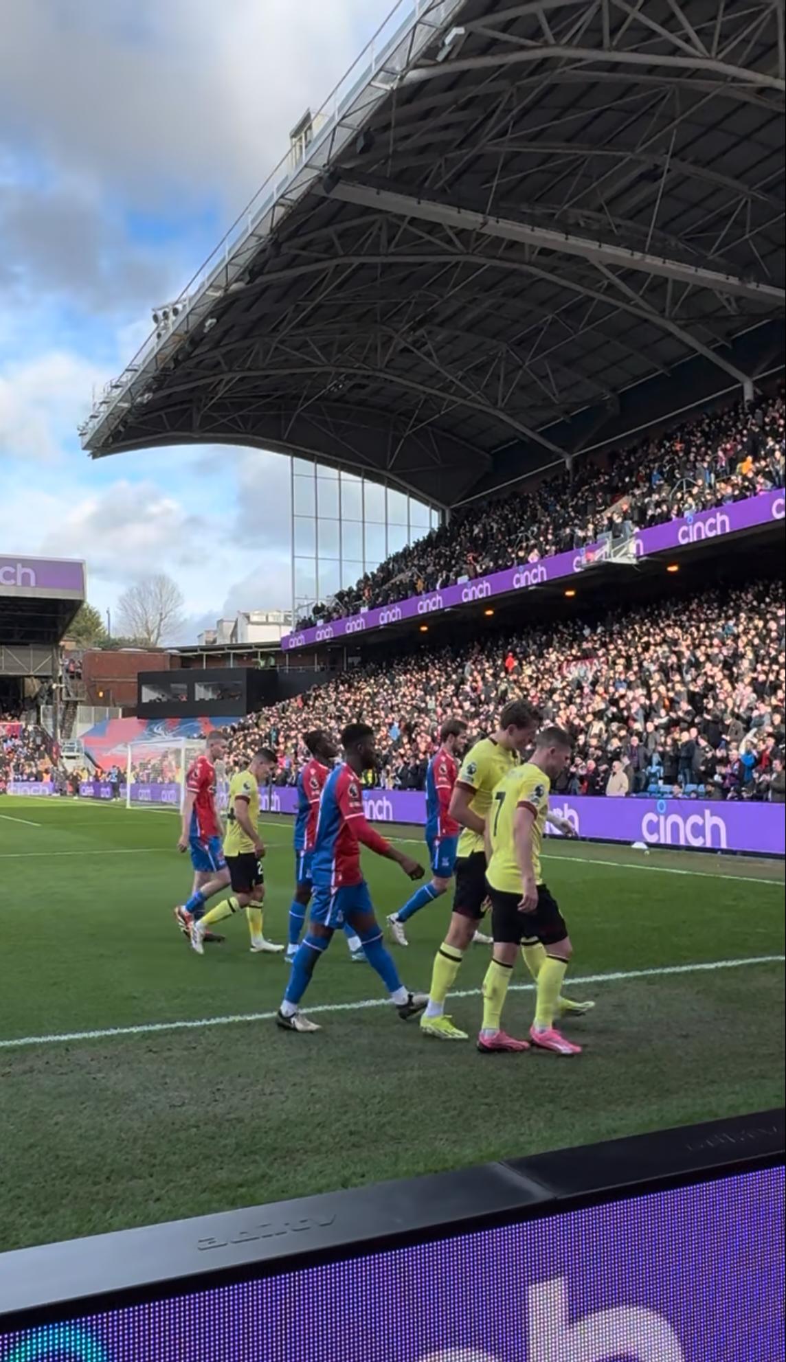 Players walking off the pitch at Selhurst Park during a Crystal Palace home match.